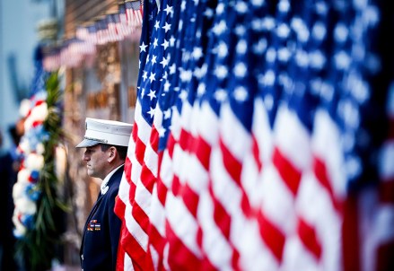 A New York City firefighter stands as an honor guard by a memorial wall for the 343 firefighters killed on 9/11 as part of ceremonies marking the 17th anniversary of the terrorist attacks in New York, New York, USA, 11 September 2018.
17th Anniversary of September 11 in New York, USA - 11 Sep 2018