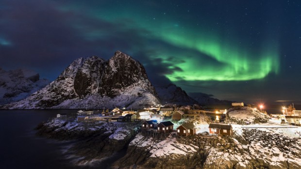 Town and fisherman's cabins or Rorbus in front of snowy mountains, aurora borealis, winter, Sakrisoeya, Moskenesoey, Lofoten, Norway
VARIOUS