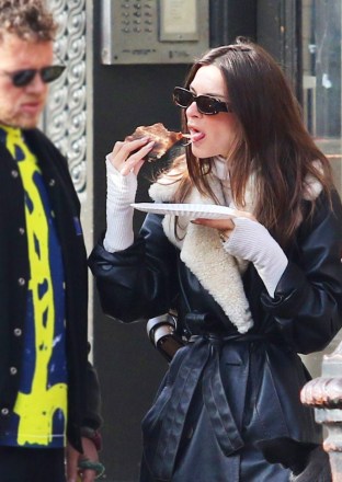 Emily Ratajkowski enjoys a slice of pizza while out with her husband Sebastian and their dog Colombo in Manhattan's Downtown area. The couple were seen spending the day at a dog park while cuddling and kissing. Then later Emily ate a slice of pizza by herself while her husband looked on. 28 Dec 2019 Pictured: Emily Ratajkowski. Photo credit: LRNYC / MEGA TheMegaAgency.com +1 888 505 6342 (Mega Agency TagID: MEGA575009_003.jpg) [Photo via Mega Agency]