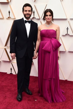 Aaron Lohr, Idina Menzel.  Aaron Lohr, left, and Idina Menzel arrive at the Oscars, at the Dolby Theater in Los Angeles 92nd Academy Awards - Arrivals, Los Angeles, USA - 09 Feb 2020