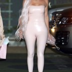 Khloé Kardashian wears a tight pink leather dress as she leaves Goya Studios