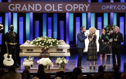 The group Little Big Town, from left, Jimi Westbrook, Kimberly Schlapman, Karen Fairchild and Phillip Sweet, performs during a memorial service for country music singer Troy Gentry at the Grand Ole Opry House, in Nashville, Tenn. Gentry, who made up the duo Montgomery Gentry with Eddie Montgomery, died Sept. 8 in a helicopter crash
Troy Gentry Memorial, Nashville, USA - 14 Sep 2017