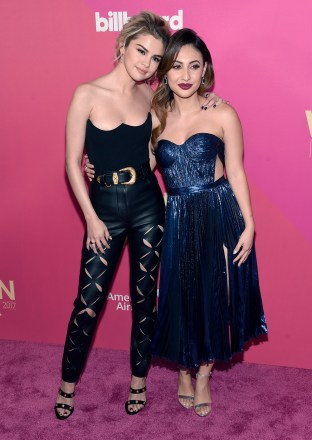 Selena Gomez, left, and Francia Raisa arrive at the Billboard Women in Music event at the Ray Dolby Ballroom on Thursday, Nov. 30, 2017, in Los Angeles. (Photo by Chris Pizzello/Invision/AP)
