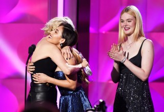 Presenter Francia Raisa, center, hugs woman of the year award winner Selena Gomez, left, as presenter Elle Fanning looks on at the Billboard Women in Music event at the Ray Dolby Ballroom on Thursday, Nov. 30, 2017, in Los Angeles. (Photo by Chris Pizzello/Invision/AP)