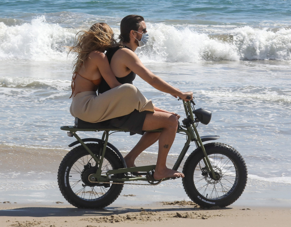 *EXCLUSIVE* Sofia Richie holds on tight to Scott Disick as they have some fun riding a motorbike on the beach!