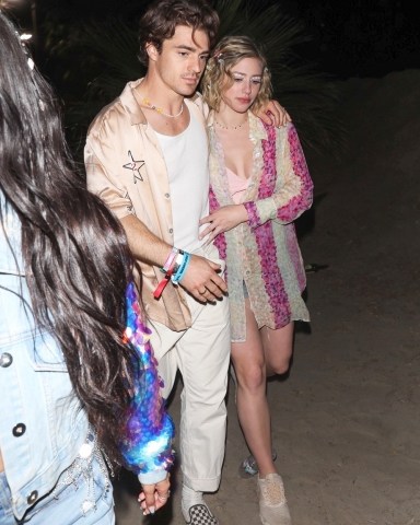 Indio, CA  - Lili Reinhart and new boyfriend couple up at Coachella's Neon Carnival.  Pictured: Lili Reinhart  BACKGRID USA 17 APRIL 2022   BYLINE MUST READ: Mr. Bueno / BACKGRID  USA: +1 310 798 9111 / usasales@backgrid.com  UK: +44 208 344 2007 / uksales@backgrid.com  *UK Clients - Pictures Containing Children Please Pixelate Face Prior To Publication*