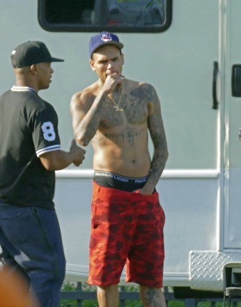 American hip-hop / r&b / pop singer Chris Brown was pictured shirtless while on break from filming a music video with DJ Khaled, August Alsina, Fetty Wap, and other artists, models, and friends. His regained fit body can be seen as he shed the extra weight that he put on a while back. His hand was also resting inside the crotch area of his shorts.Pictured: Chris BrownRef: SPL1115927 020915 NON-EXCLUSIVEPicture by: SplashNews.comSplash News and PicturesLos Angeles: 310-821-2666New York: 212-619-2666London: +44 (0)20 7644 7656Berlin: +49 175 3764 166photodesk@splashnews.comWorld Rights