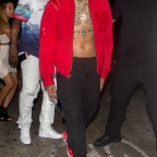 Chris Brown shirtless with just an open jacket seen leaving 'Argyle' Night Club in Hollywood, CA