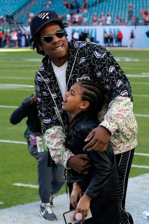 Entertainer Jay-Z hugs his daughter Blue Ivy Carter as they arrive at the NFL Super Bowl 54 football game between the San Francisco 49ers and the Kansas City Chiefs, at Miami 49ers Chiefs Super Bowl Football, Miami Gardens, USA - 02 February 2020