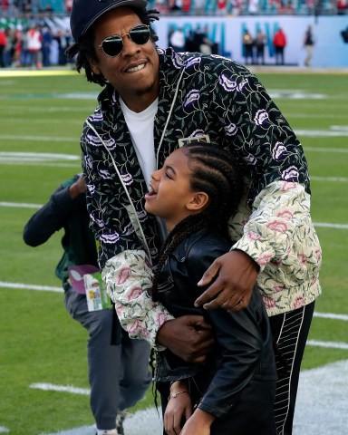 Entertainer Jay-Z embraces his daughter Blue Ivy Carter as they arrive for the NFL Super Bowl 54 football game between the San Francisco 49ers and the Kansas City Chiefs, in Miami 49ers Chiefs Super Bowl Football, Miami Gardens, USA - 02 Feb 2020