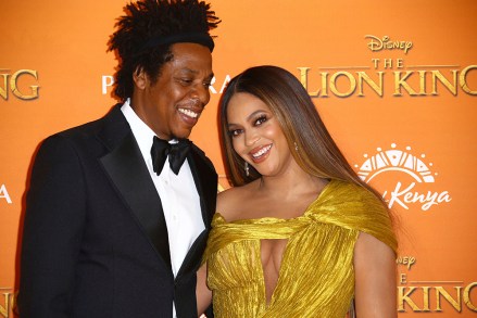 Jay-Z, Beyonce.  Singers Jay-Z, left, and Beyonce pose for photographers upon arrival at the European Premiere of 'The Lion King' in Central LondonLion King Premiere, London, UK - 14 Jul 2019