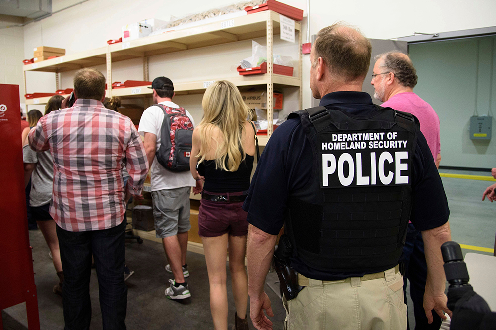 Police arrive at the scene to escort concertgoers to safety after hiding inside the Sands Corporation plane hangar after a gunman opened fire at the Route 91 Harvest Festival, in Las Vegas
Shooting, Las Vegas, USA - 02 Oct 2017