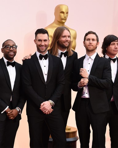 Mickey Madden, from left, PJ Morton, Adam Levine, James Valentine, Jesse Carmichael, Matt Flynn, and Sam Farrar of the musical group Maroon 5 arrive at the Oscars, at the Dolby Theatre in Los Angeles 87th Academy Awards - Arrivals, Los Angeles, USA
