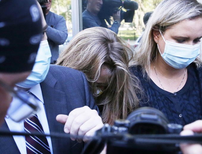 Allison Mack hides from paparazzi at her sentencing