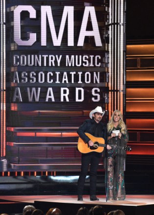 Hosts Brad Paisley, left, and Carrie Underwood perform at the 51st annual CMA Awards at the Bridgestone Arena on Wednesday, Nov. 8, 2017, in Nashville, Tenn. (Photo by Chris Pizzello/Invision/AP)