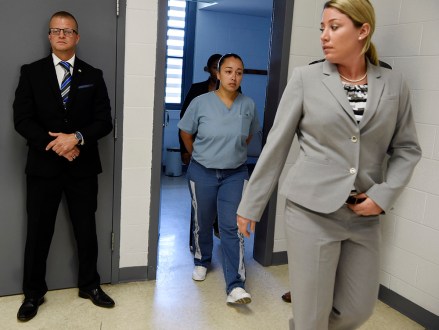 Cyntoia Brown, a woman serving a life sentence for killing a man when she was a 16-year-old prostitute, enters her clemency hearing Wednesday, May 23, 2018, at Tennessee Prison for Women in Nashville, Tenn. It is her first bid for freedom before a parole board since the 2004 crime. (Lacy Atkins /The Tennessean via AP, Pool)