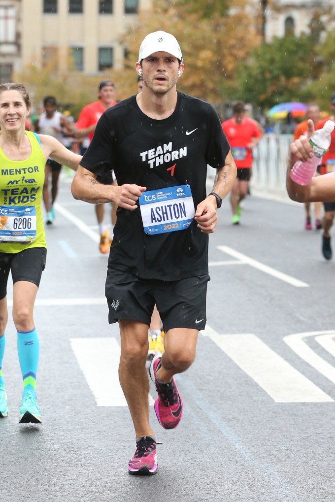 Ashton Kutcher Runs Through Harlem In The New York City Marathon