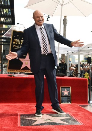 Talk show host Dr.  Phil McGraw poses atop his new star on the Hollywood Walk of Fame during a ceremony, in Los Angeles Dr.  Phil Honored with a Star on the Hollywood Walk of Fame, Los Angeles, USA - 21 Feb 2020