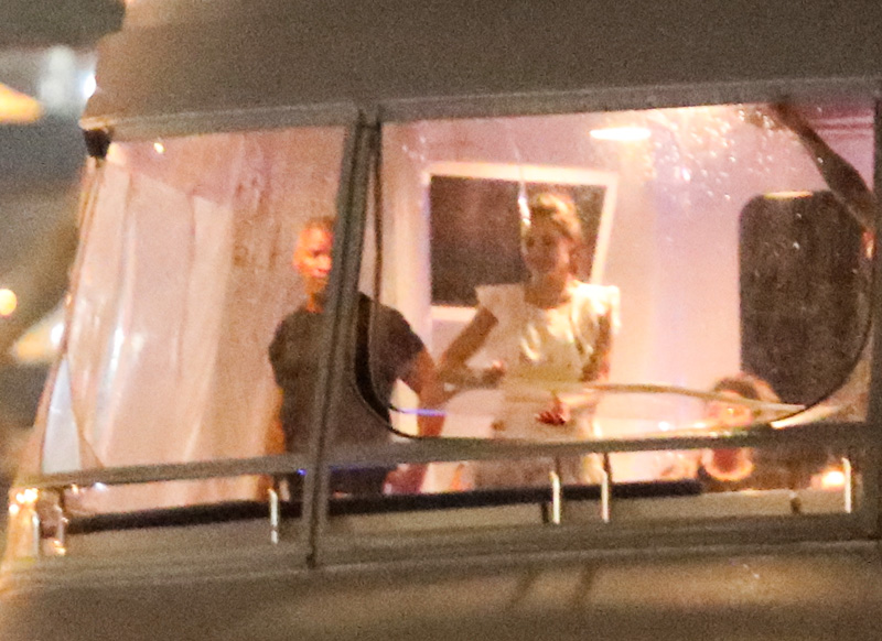 Katie Holmes and Jamie Foxx go for a yacht ride at night in Miami.