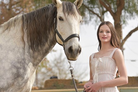 Mackenzie Foy attends an event to promote the film "Black Beauty" at Fair Hill Farms on Friday, Nov. 20, 2020, in Topanga, Calif. (Richard Shotwell/Invision/AP)