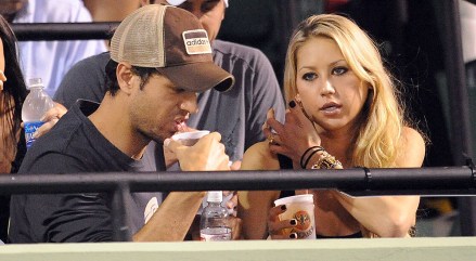Singer Enrique Iglesias (l) and Anna Kournikova (r) Watch Serena Williams of the Usa Play Against Her Sister Venus Williams During Their Sony Ericsson Open Tennis Match On Key Biscayne Florida Usa 02 April 2009
Usa Tennis Sony Ericsson Open - Apr 2009
