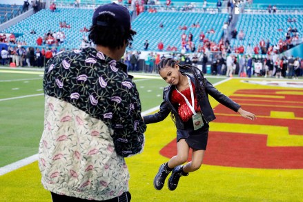 Entertainer Jay-Z watches his daughter Blue Ivy Carter leap on the field before the NFL Super Bowl 54 football game between the San Francisco 49ers and the Kansas City Chiefs, in Miami
49ers Chiefs Super Bowl Football, Miami Gardens, USA - 02 Feb 2020