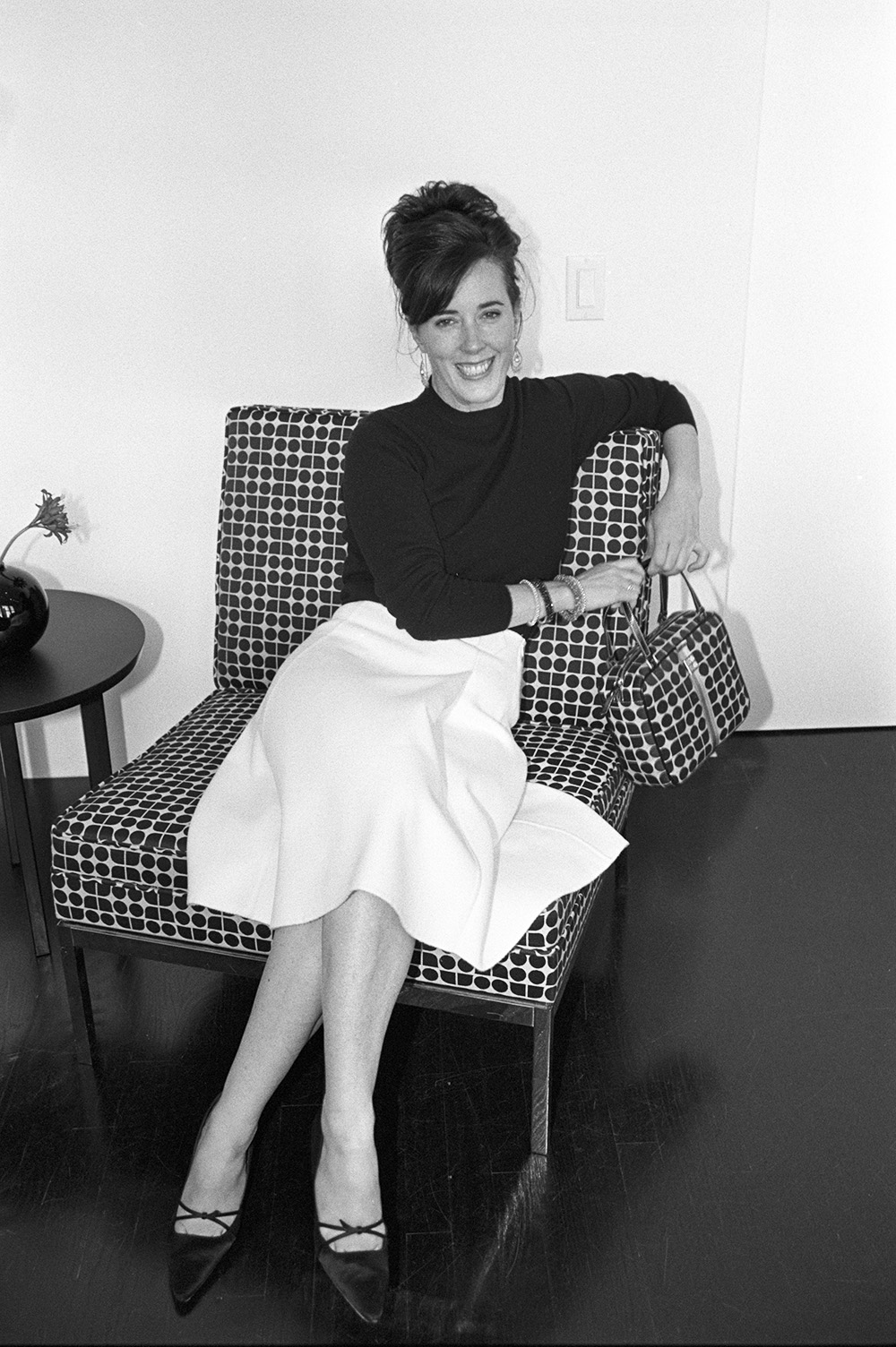 Handbag designer Kate Spade sitting on a chair with a matching pattern handbag in her showroom in New York.Kate Spade, New York