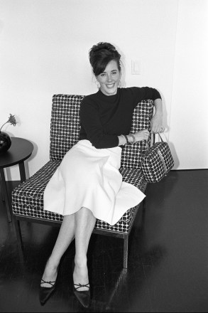 Handbag designer Kate Spade sitting on a chair with a matching pattern handbag in her showroom in New York.Kate Spade, New York