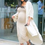 Kim Kardashian smiles as showing her belly bump while leaving Jeffrey store in Meatpacking District in New York City