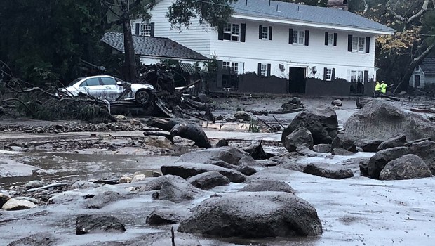 HANDOUT EDITORIAL USE ONLY/NO SALES
Mandatory Credit: Photo by MIKE ELIASON/SANTA BARBARA COUNTY FIRE/HANDOUT HANDOUT/EPA-EFE/REX/Shutterstock (9312899y)
A handout photo made available by the Santa Barbara County Fire Departments shows Santa Barbara County Firefighters work admist flood waters and debris flow during heavy rains in Montecito, California, USA, 09 January 2018. Heavy rains overnight combined with large areas burned by the Thomas Fire combined for flash flooding and mudslide risk.
Mudslides follow wildfires, Montecito, USA - 09 Jan 2018