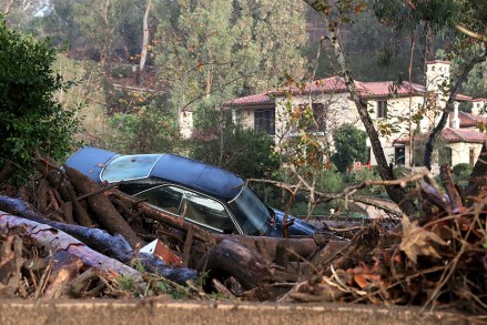 A car is piled up in debris after a mudslide trapped it  after heavy rains in Montecito, California, USA, 09 January 2018.  A rain storm in southern California has destroyed several homes and killed at least 13 people in Montecito, California and closed a 35 mile stretch of the 101 freeway.
Mudslides in southern California after wildfires, Montecito, USA - 09 Jan 2018