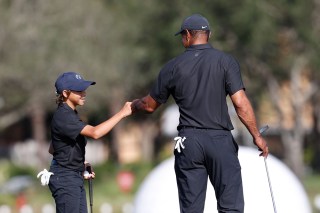 Tiger Woods, right, fist bumps his son Charlie during the first round of the PNC Championship golf tournament, in Orlando, Fla. Woods is back playing after getting injured in a car accident. He is paired with his son Charlie during the tournament
PNC Championship Golf, Orlando, United States - 17 Dec 2021