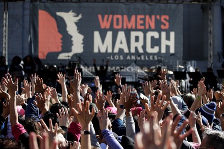 People hold their hands up at a Women's March against sexual violence and the policies of the Trump administration, in Los Angeles
Womens March , Los Angeles, USA - 20 Jan 2018