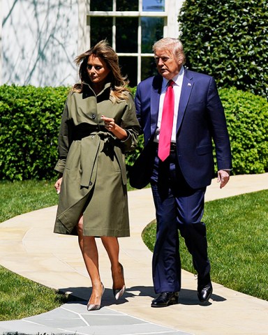 President Donald Trump and first lady Melania Trump arrive for a tree planting ceremony to celebrate Earth Day, on the South Lawn of the White House, in Washington Virus Outbreak Trump, Washington, United States - 22 Apr 2020