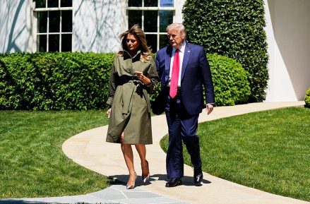 President Donald Trump and first lady Melania Trump arrive for a tree planting ceremony to celebrate Earth Day, on the South Lawn of the White House, in Washington
Virus Outbreak Trump, Washington, United States - 22 Apr 2020