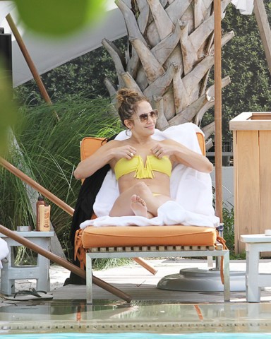 Singer Jennifer Lopez hits the pool with her entourage at their hotel in Miami, Florida on August 30, 2012. Lopez enjoyed tanning and relaxing on the lounge chairs while her son Max, daughter Emme and her boyfriend Casper Smart took a dip and played in the pool. Pictured: JENNIFER LOPEZ,CASPER SMART,JENNIFER LOPEZCASPER SMARTRef: SPL428259 300812 NON-EXCLUSIVEPicture by: SplashNews.comSplash News and PicturesLos Angeles: 310-821-2666New York: 212-619-2666London: +44 (0)20 7644 7656Berlin: +49 175 3764 166photodesk@splashnews.comWorld Rights