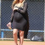 Pregnant Khloe Kardashian Flaunts Baby Bump During Family Softball Game