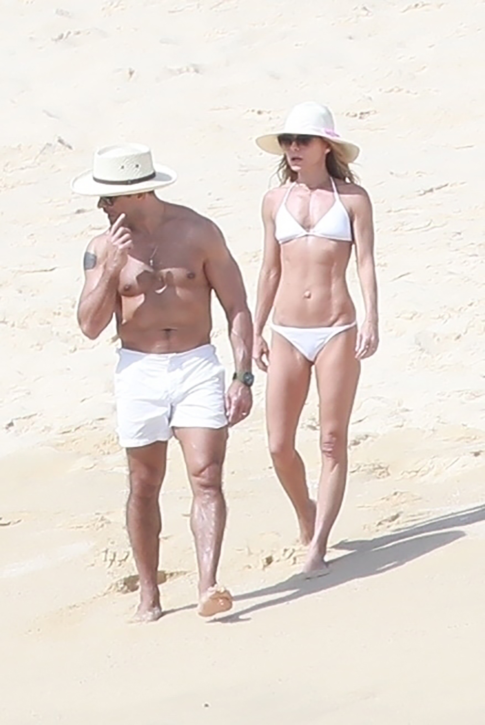 Cabo San Lucas, MEXICO - *EXCLUSIVE* - The mother-of-three showed off her rock-hard body in a tiny white bikini while strolling the Sable with husband Mark Consuelos Pictured: Kelly Ripa and Mark Consuelos BACKGRID USA JANUARY 27, 2019 BYLINE MUST READ: HEM / BACKGRID USA: +1 310 798 9111 / usasales@backgrid.com UK: +44 208 344 2007 / uksales @backgrid.com *UK Customers - Images containing children, please rasterize face before posting*