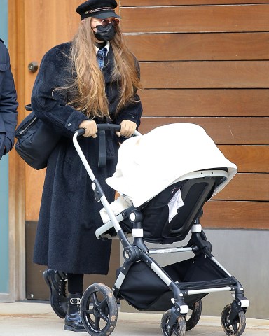 Model, Gigi Hadid is seen walking a stroller with her daughter for the first time in New York City.  Pictured: Gigi Hadid Ref: SPL5203160 151220 NON-EXCLUSIVE Picture by: Christopher Peterson / SplashNews.com  Splash News and Pictures USA: +1 310-525-5808 London: +44 (0)20 8126 1009 Berlin: +49 175 3764 166 photodesk@splashnews.com  World Rights