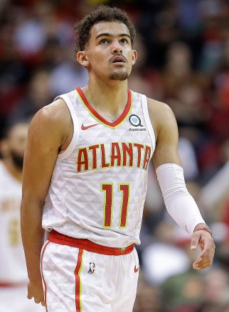 CORRECTS YEAR TO 2019 NOT 2018 - Atlanta Hawks guard Trae Young (11) looks at the scoreboard during a timeout during the second half of an NBA basketball game against the Houston Rockets, Monday, Feb. 25, 2019, in Houston. (AP Photo/Eric Christian Smith)