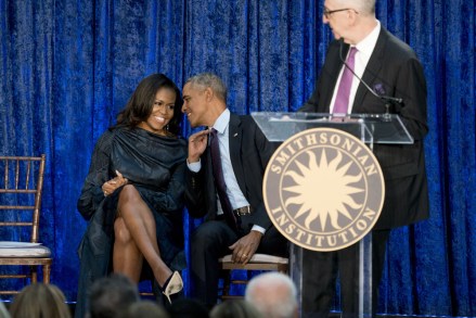 Barack Obama, Michelle Obama, Brandon Fortune. Former President Barack Obama and former first lady Michelle Obama speak together as National Portrait Gallery Chief Curator Brandon Fortune, right, speaks at an unveiling ceremony for the Obama's official portraits at the Smithsonian's National Portrait Gallery, in Washington
Obama Portrait, Washington, USA - 12 Feb 2018