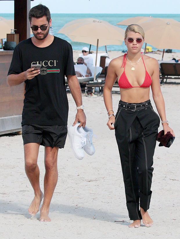 Sofia Richie and Scott Disick on the beach