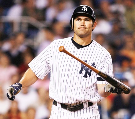 New York Yankees' Johnny Damon tosses his bat after striking out to end the eighth inning against the Cleveland Indians during Game 4 of an American League Division Series baseball game Monday, Oct. 8, 2007 at Yankee Stadium in New York. The Indians won 6-4 to clinch the Division Series. (AP Photo/Kathy Willens)