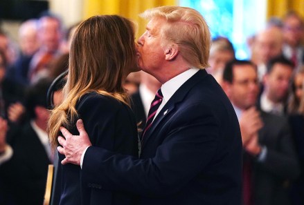 US President Donald Trump (R) kisses First Lady Melania Trump (L) as he speaks in the East Room of the White House a day after his Senate impeachment trial acquittal in Washington, DC, USA, 06 February 2020. Trump was found not guilty on two articles of impeachment 05 February after a two-week trial.
President Trump comments on his impeachment trial aquittal at the White House, Washington, USA - 06 Feb 2020