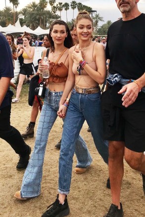 Indio, CA  - *EXCLUSIVE*  - Model sisters Gigi and Bella Hadid enjoy day 3 of Coachella Music Festival. The model sisters looked stylish in bohemian style bra tops and high waisted jeans.

Pictured: Gigi Hadid, Bella Hadid 

BACKGRID USA 16 APRIL 2018 

BYLINE MUST READ: Roger / BACKGRID

USA: +1 310 798 9111 / usasales@backgrid.com

UK: +44 208 344 2007 / uksales@backgrid.com

*UK Clients - Pictures Containing Children
Please Pixelate Face Prior To Publication*
