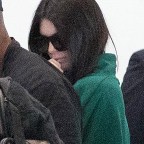 Kendall Jenner covers up at the the Paris airport catching a flight to LA