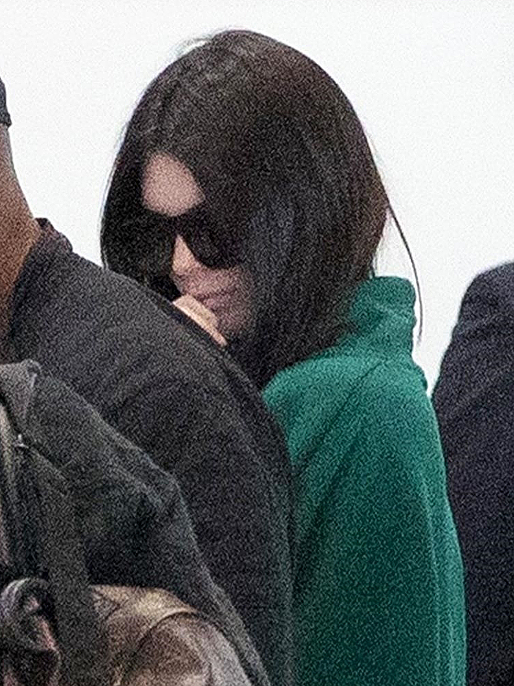 Kendall Jenner covers up at the the Paris airport catching a flight to LA