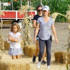 EXCLUSIVE: Kendra Wilkinson carries a  couple of pumpkins as she stops by a pumpkin patch in Woodland Hills