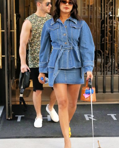 Singer Nick Jonas, wearing a camouflage vest and shorts, and Priyanka Chopra, wearing an all-denim outfit, leave their apartment with their dog Diana in New York City

Pictured: Nick Jonas,Priyanka Chopra
Ref: SPL5112148 310819 NON-EXCLUSIVE
Picture by: Christopher Peterson / SplashNews.com

Splash News and Pictures
Los Angeles: 310-821-2666
New York: 212-619-2666
London: 0207 644 7656
Milan: +39 02 56567623
photodesk@splashnews.com

World Rights
