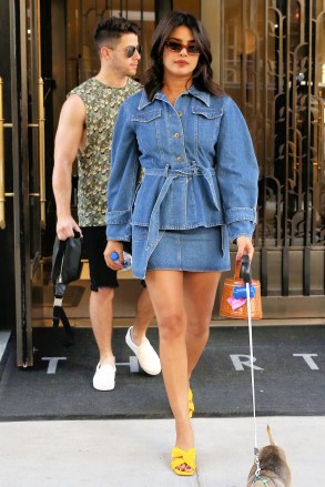 Singer Nick Jonas, wearing a camouflage vest and shorts, and Priyanka Chopra, wearing an all-denim outfit, leave their apartment with their dog Diana in New York CityPictured: Nick Jonas,Priyanka ChopraRef: SPL5112148 310819 NON-EXCLUSIVEPicture by: Christopher Peterson / SplashNews.comSplash News and PicturesLos Angeles: 310-821-2666New York: 212-619-2666London: 0207 644 7656Milan: +39 02 56567623photodesk@splashnews.comWorld Rights
